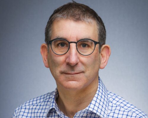 Dr Justin Daniels smiling at the camera.