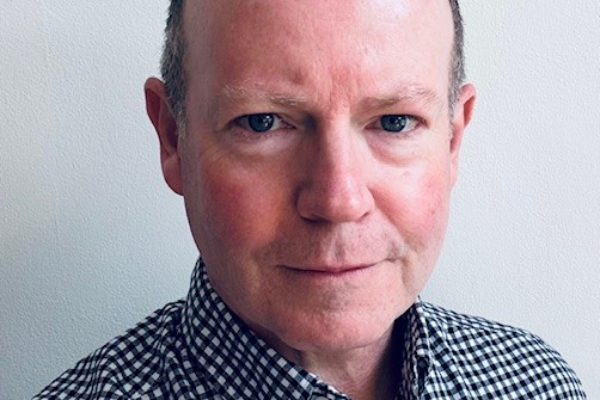 A professional headshot photo of Barry Jenkins, interim Chief Finance Officer at East and North Hertfordshire Teaching NHS Trust.